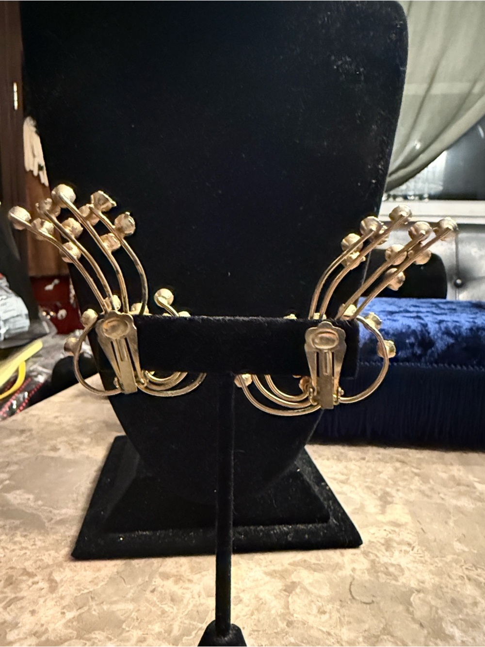 Vintage 1940s gold tone cascading up the ear, pale blue and purple rhinestones